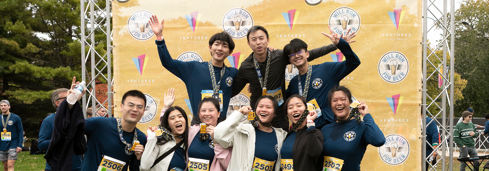 Friends post race with medals and snacks